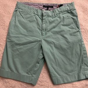 Turquoise flat front shorts.